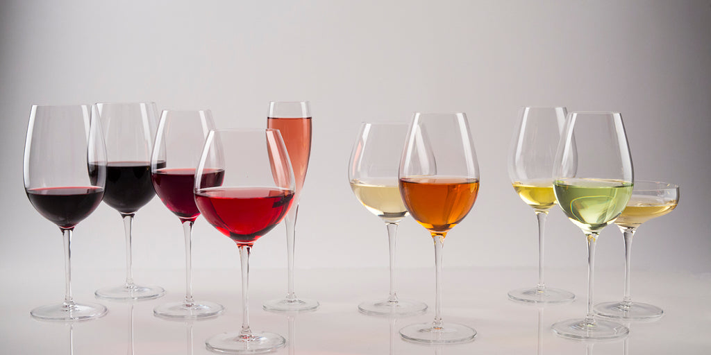 Different colored wine in various stems