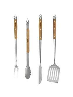 Four stainless steel outdoor grilling tools with light wood handles, including a fork, tongs, skewer knife, and spatula, arranged side by side on a white background.