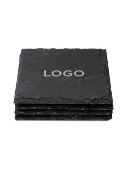 A stack of square black slate coasters on a plain white background, with the top coaster displaying the word 'LOGO' in white text.