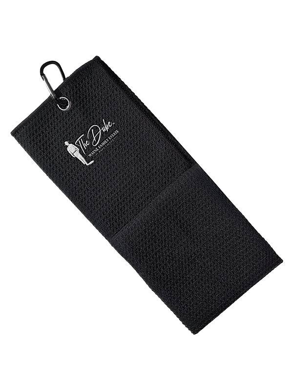 Black golf towel with 'The Duke' logo on a white background
