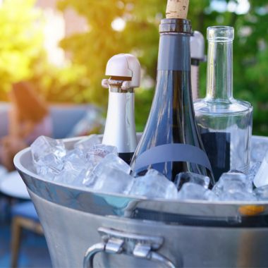 wines chilling in ice bucket on table