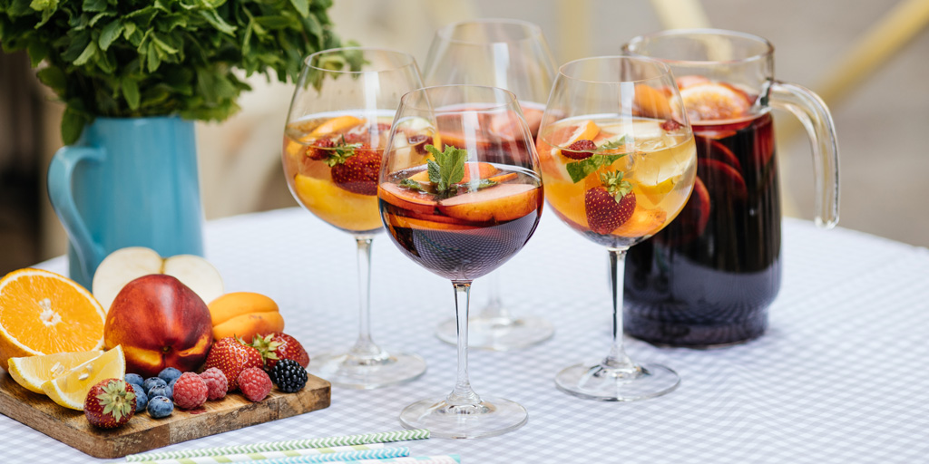 Crowd-Pleasing Tasting Themes - different sangrias on an outdoor table