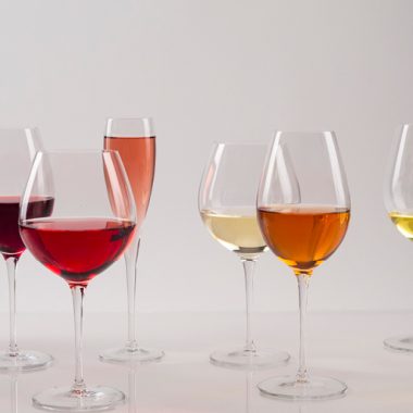 Different colored wine in various stems