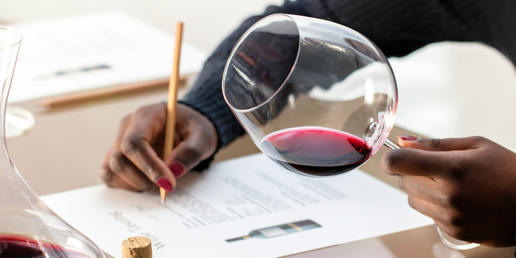 Pointless Wines? Woman scoring and analyzing wine
