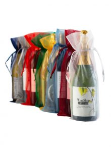 WineShop At Home wine bottles displayed in elegant organza fabric bottle bags in an assortment of colors: Burgundy, Gold, Green, Navy Blue, Red, Silver, Smokey Blue and White.