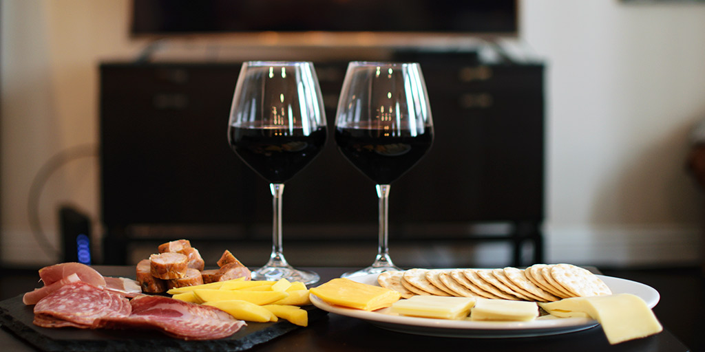 Wine with meats, cheese and crackers for movie night