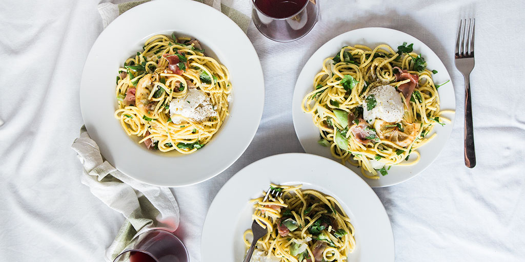 Pasta dishes with wine glasses