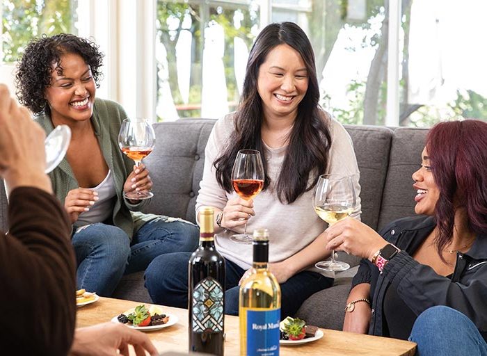 Women of various nationalities enjoying some WineShop At Home wine