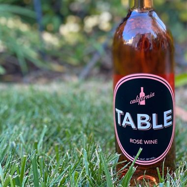 A bottle of Table Rosé Wine on grass