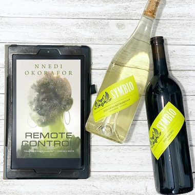 A bottle of Symbio 2020 Gewürztraminer and 2020 Malbec next to a digital copy of "Remote Control"
