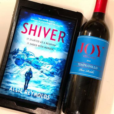 A bottle of Joy Cellars 2018 Tempranillo next to a digital copy of "Shiver"