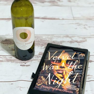 A bottle of Infinite Widsom 2020 Shiraz next to a digital copy of "Velvet was the Night"