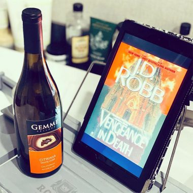 A bottle of Gemme Cellars Citrina White Wine next to a digital version of "Vengeance In Death"