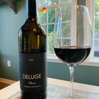 A glass and bottle of Deluge 2012 Storm
